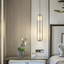White Glass & Metal Art Deco Chandelier illuminating a stylish bedroom with elegant decor.