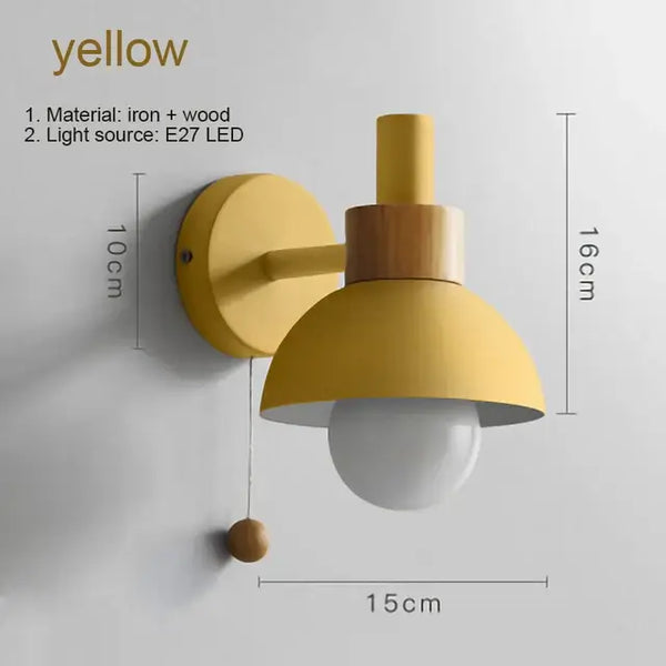 Pull Chain Nordic Sconce in yellow with wooden accents, ideal for children's bedside lighting.