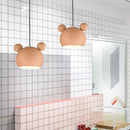 Two Cartoon Mouse Lamp Shades hanging in a modern kitchen with patterned tiles.