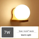 Wood and Frosted Glass Japanese Minimalist Sconces featuring a warm light design and sleek craftsmanship.