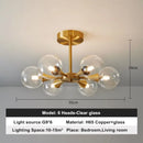 Modern Copper Glass Ball Chandelier featuring a unique design with six clear glass heads and a copper finish.