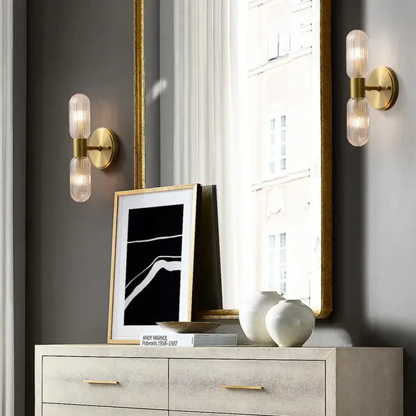 Radiant Luxe Gold Wall Sconce enhancing a chic indoor space with modern lighting and elegant decor.