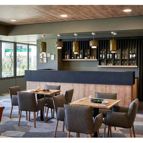 Modern Glass Pendant Light – Italian-Inspired LED Suspension Lamp illuminating a stylish restaurant interior