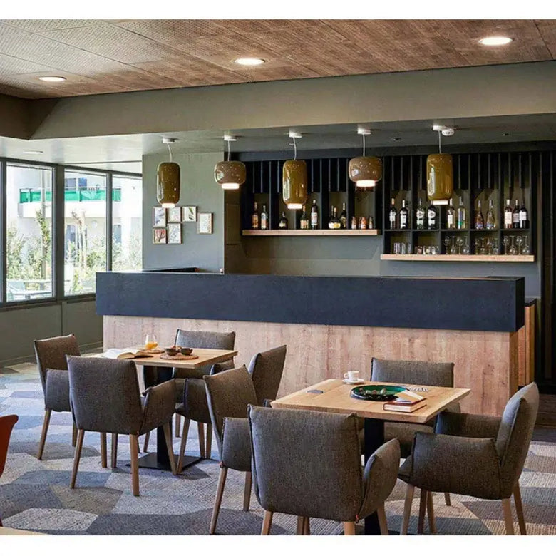 Modern Glass Pendant Light – Italian-Inspired LED Suspension Lamp illuminating a stylish restaurant interior