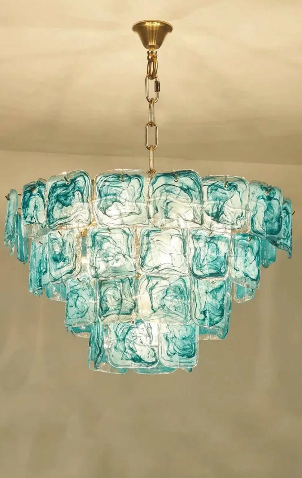 Blue Glass Chandelier with Polished Chrome Finish, handcrafted glass shades adding elegance to interiors.