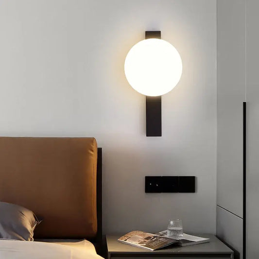 Modern Simple Art Deco Revival Wall Lamp illuminating a stylish bedroom with a cozy ambiance.