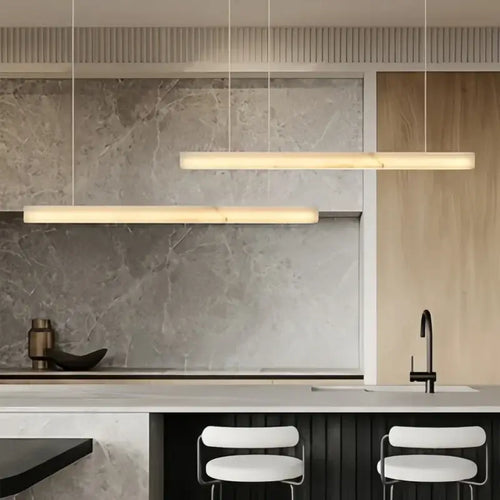 Natural Marble Linear Pendant Light 80–120cm hanging over a modern kitchen island with a sleek design.