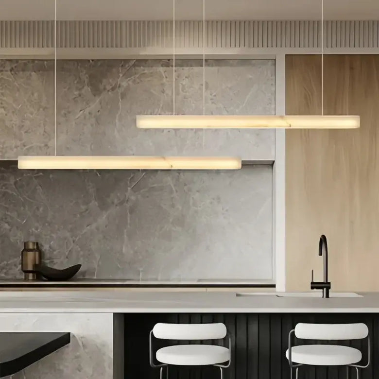 Natural Marble Linear Pendant Light 80–120cm hanging over a modern kitchen island with a sleek design.