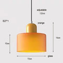 Colourful Glass Pendant (15cm x 16cm) in orange, adjustable length, modern design with glass shade.