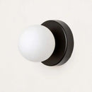 Colourful Macaron LED Wall Lamp 10/12cm mounted on wall with frosted glass bulb in black fixture.