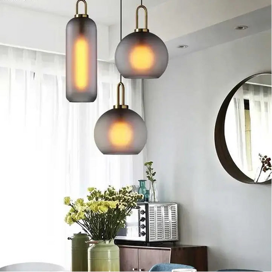 Grey Frosted Sphere Glass Hanging Lamp in a modern living room setting.