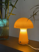 Nordic Mushroom Table Lamp – Retro-Inspired Glass & Iron Mood Light with warm yellow glow on a wooden table.