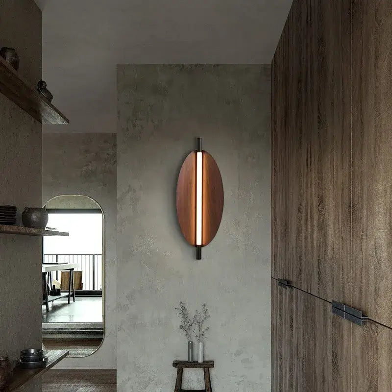 Modern Brown Leaf Wall Light – Sculptural LED Wall Sconce in Metal mounted on a wall in a contemporary home.