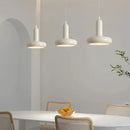 60s Scandinavian Style Kitchen Pendant Lamp in cream color illuminating a modern kitchen table with stylish decor.