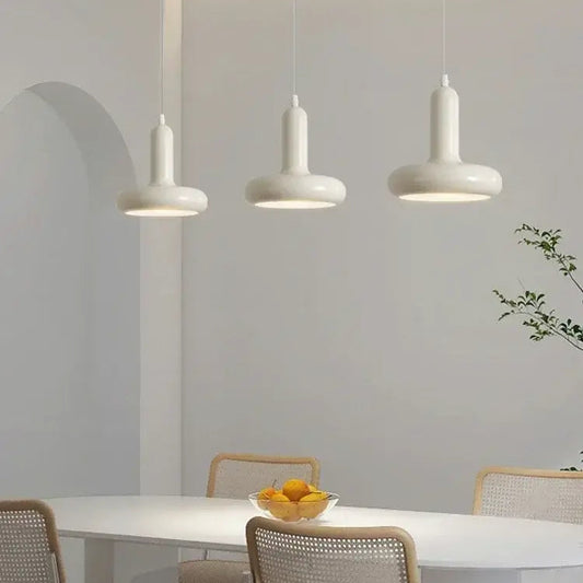 60s Scandinavian Style Kitchen Pendant Lamp in cream color illuminating a modern kitchen table with stylish decor.