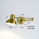 Vintage Loft Bedside Reading Light Fixture with adjustable arm and dimmable shade, brass finish, ideal for bedside reading.