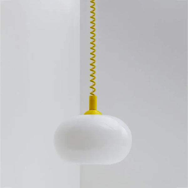 Bauhaus Glass Chandeliers with bright cord, featuring a white hand-blown glass shade and vibrant yellow spiral cord.