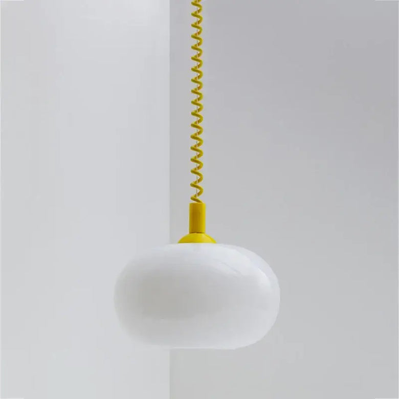 Bauhaus Glass Chandeliers with bright cord, featuring a white hand-blown glass shade and vibrant yellow spiral cord.