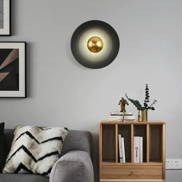 Colourful 30 cm Modern Circle Wall Light with Gold elegantly illuminating a stylish living room.