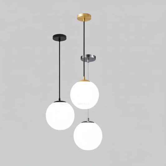 hero Modern pendant light with three spherical white shades on a plain background