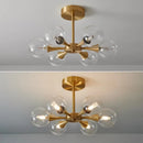 Modern Copper Glass Ball Chandelier with trumpet-like arms and frosted glass shades for warm ambiance