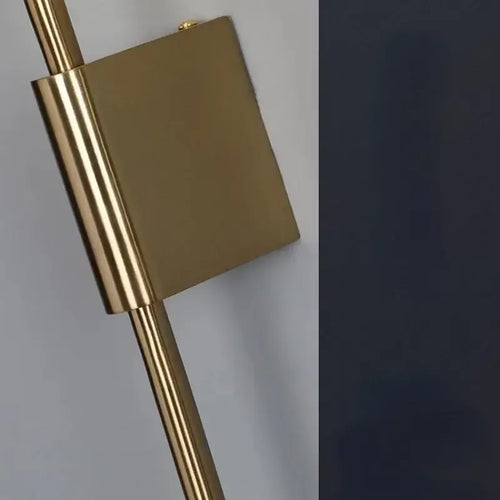 Close-up view of the Lollipop Art Deco Wall Light Fixture showcasing its elegant metal design.