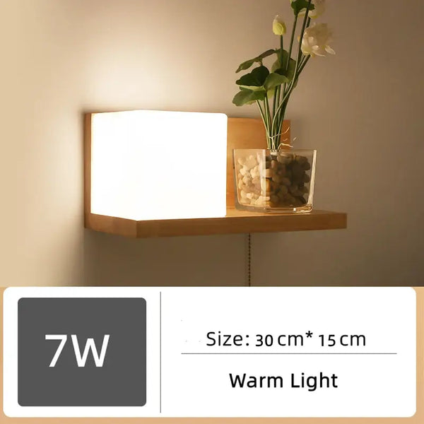 Wood and Frosted Glass Japanese Minimalist Sconces featuring a warm light and plant integration on a wooden shelf.