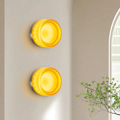 Futuristic and Unique Solid Plexiglass Wall Light illuminating a modern interior with a warm glow.