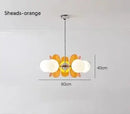 Rare Mid-Century Orange Plexiglass Chandelier: A Unique Vintage Gem with orange reflectors and white frosted glass balls.