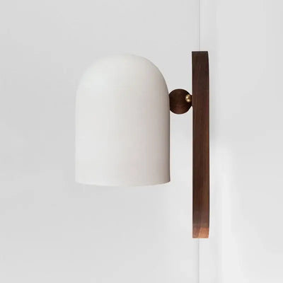 Elegant Walnut Wood and Iron Wall Lamp illuminating a modern interior with a minimalistic design.