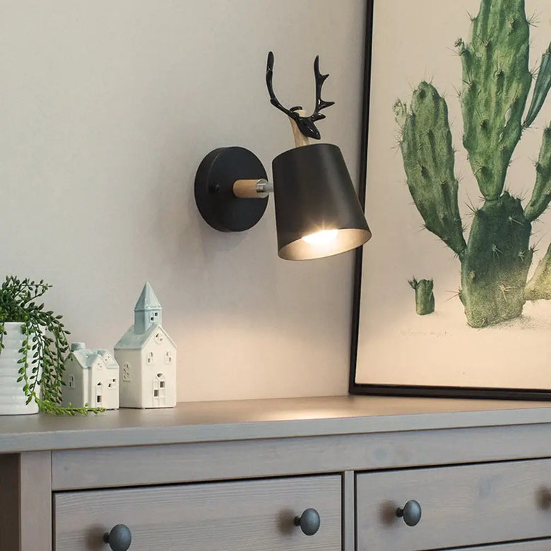 Collection of Modern Nordic Wooden Wall Lights with black shade and antler design, illuminating stylish interior.