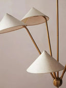 Chic Japansese Mid-Century Modern Ceiling Pendant featuring golden rods and elegant fabric shades.