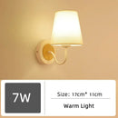 Wood and Frosted Glass Japanese Minimalist Sconces with warm light and wood accent, perfect for serene ambiance.