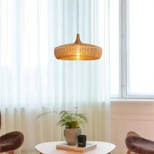 Vintage Wooden Pendant Light – Handcrafted Nordic Birdcage Lamp illuminating a stylish living space with natural bamboo design.