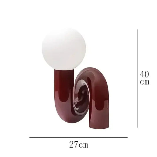 Sculptural Resin Table Lamp – Italian-Inspired Modern Lighting featuring a polished resin design and frosted glass globe.