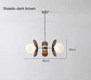 Rare Mid-Century Orange Plexiglass Chandelier: A Unique Vintage Gem, featuring three heads and dark brown accents.