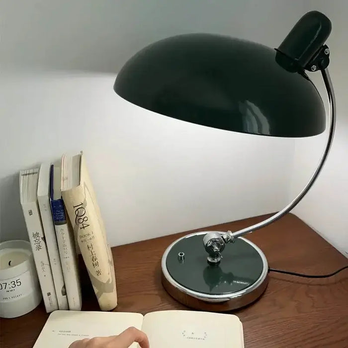 Bedside Table Lamp - Timeless Design and Modern Functionality on a wooden desk with books and a candle.