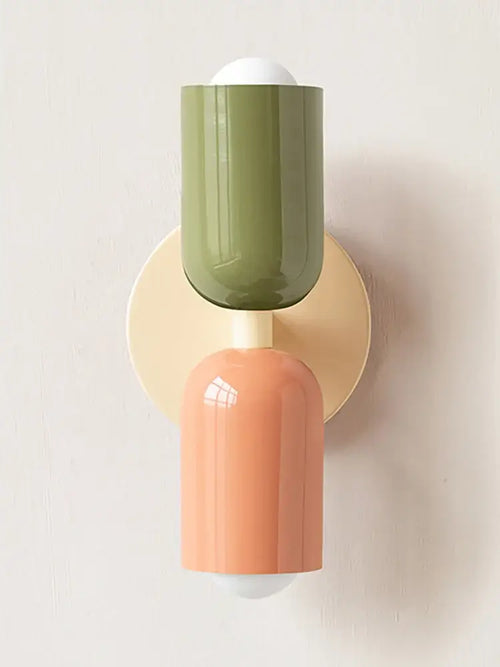 Classic Midcentury Modern Wall Lamp (10x25cm) with vibrant green and peach colors mounted on a round base.