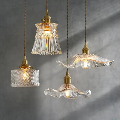 Elegant Glass Pendant Light with Brass Accents - Illuminate with Style featuring four unique designs.