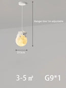 Nordic Simple Chandelier with a bear figurine hanging from a moon-shaped light, adjustable height, and ideal for modern decor.