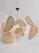 Mid-Century Modern Rattan Wall Light featuring unique organic shapes and warm lighting for stylish home decor.