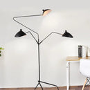 Nordic Designer Tripod Floor Lamp showcasing adjustable black arms and stylish lamp shades in an elegant living space.