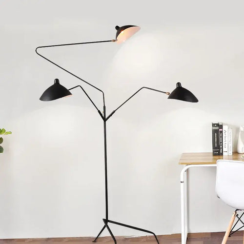 Nordic Designer Tripod Floor Lamp showcasing adjustable black arms and stylish lamp shades in an elegant living space.