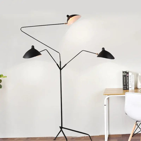 Nordic Designer Tripod Floor Lamp showcasing adjustable black arms and stylish lamp shades in an elegant living space.