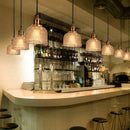 Illuminate Your Space: Stained Glass Retro Glass Chandelier in a modern bar setting with elegant lighting.