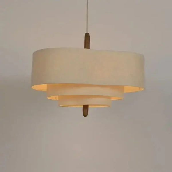 Elegant Linen Fabric Chandelier hanging lamp with soft glow, transforms any space with chic design.