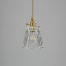 Elegant Glass Pendant Light with Brass Accents - Illuminate with Style showcasing clear glass and brass fixtures.
