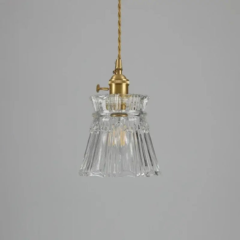 Elegant Glass Pendant Light with Brass Accents - Illuminate with Style showcasing clear glass and brass fixtures.