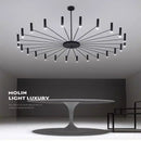 Modern Starburst LED Chandelier – 24-Light Sculptural Ceiling Statement in sleek black finish above a modern table.