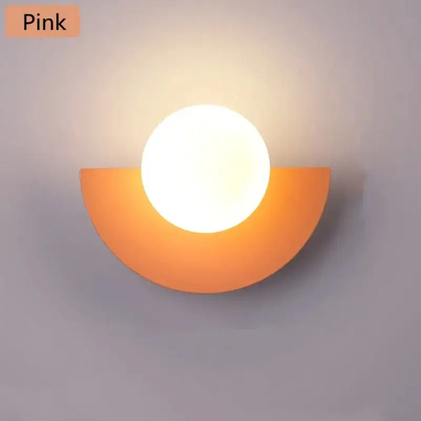 Halfmoon Metal Sconce in pink, modern Nordic design wall lamp with LED light, suitable for various spaces.